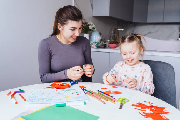istock Mother and daughter enjoying a craft project together 2200372710