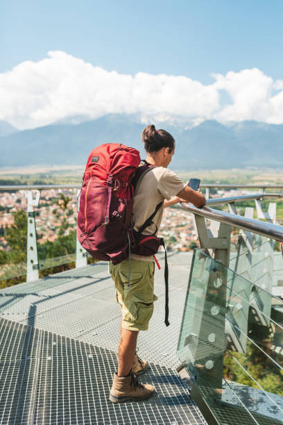 istock Young male hiker spending time outdoor and using a smart phone. 2200373034