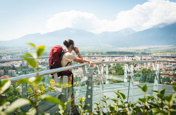istock Young male hiker spending time outdoor and using a smart phone. 2200373043