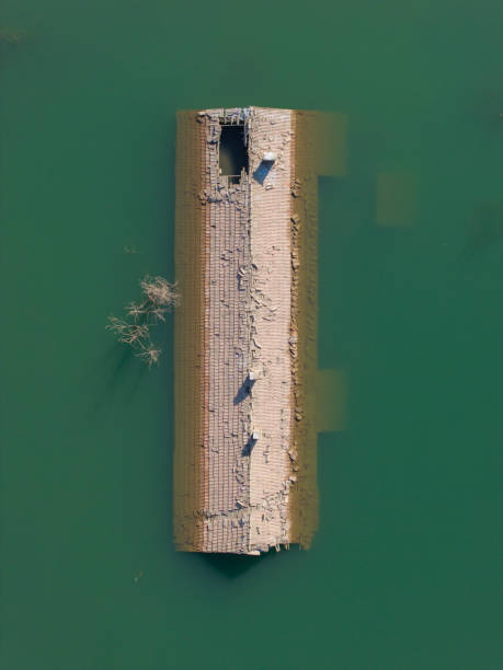 istock Sunken house by dam waters 2200374682