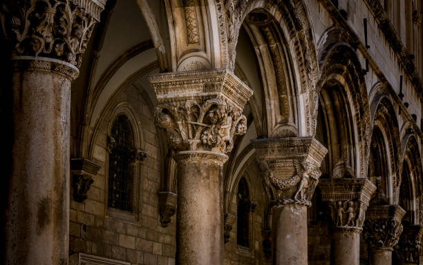 Elegant stone carvings and arches exude historical artistry. Capturing timeless design and architectural grandeur, showcasing intricate details of a decorated colonnade in a historical context.