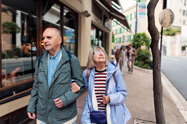 istock Senior couple walking in Monaco on an overcast day 2200376798