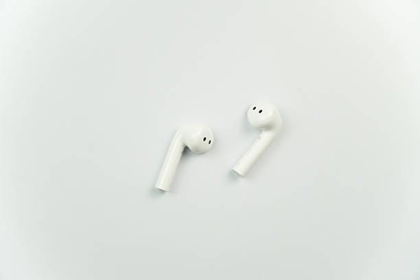 istock Minimalist White Wireless Earbuds isolated on white 2200378345
