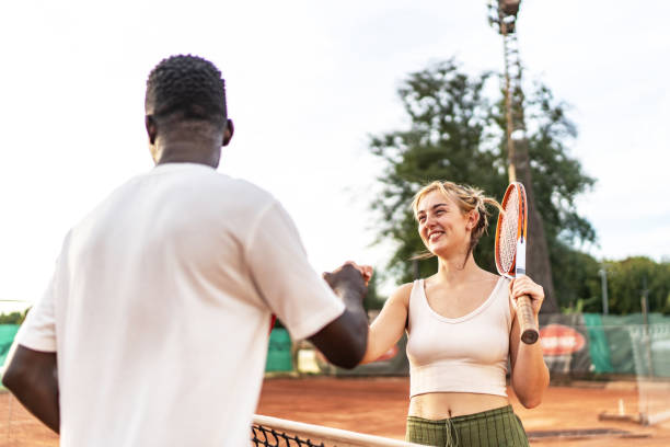 istock Two tennis players celebrating their successful game 2200379370