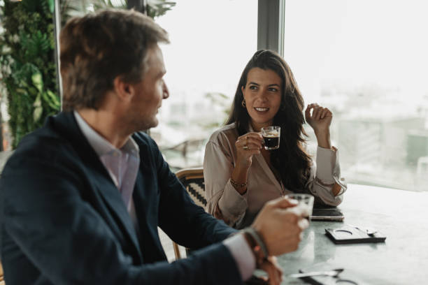istock Engaging conversation over coffee in trendy cafe 2200379386