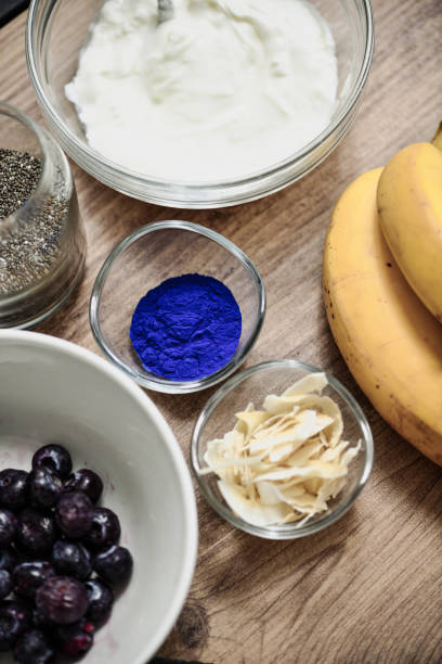 Healthy Superfood Ingredients Placed on Wooden Tray Ready for Breakfast Smoothie