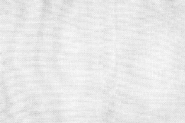 istock White color fabric canvas woven texture background in pattern light blank. Natural gauze linen, carpet wool and cotton cloth textile textured as clean empty for decoration text. Grey sack material. 2200381694