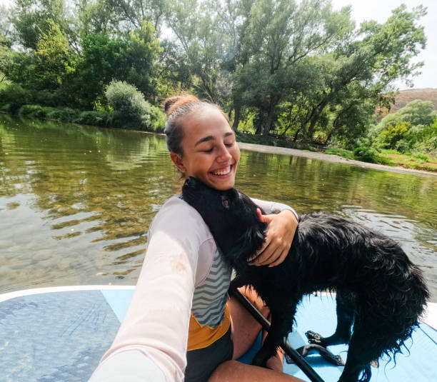 Paddleboarding on the river with my dog