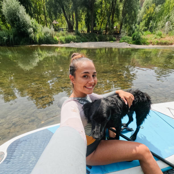 istock Paddleboarding on the river with my dog 2200381916