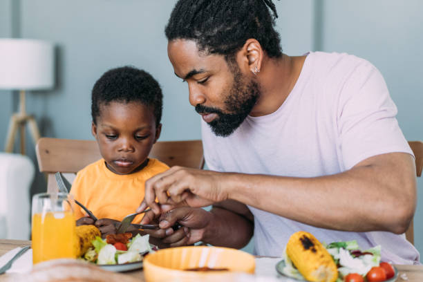 Young family enjoying lunch together.