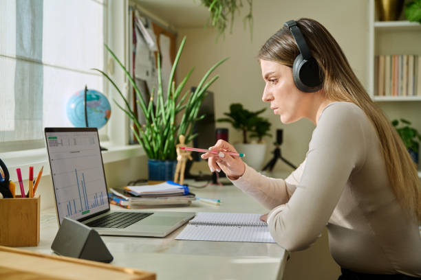 istock Young woman using typing working studying on laptop, side view of computer screen 2200382065