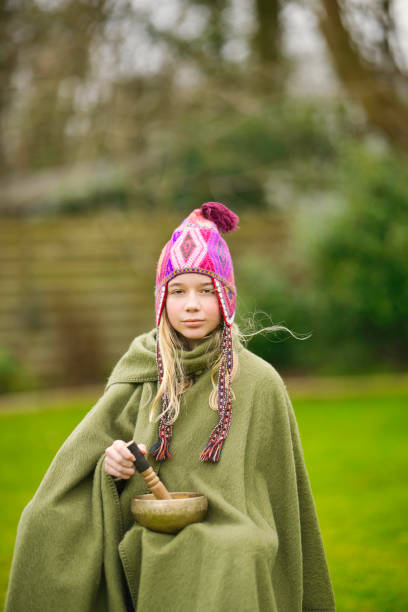 Beautiful young people in traditional Bulgarian costumes, presented doing various activities.