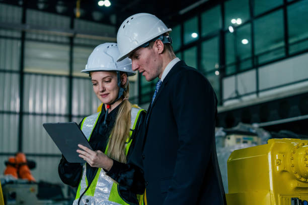 istock Professionals discussing project details in industrial facility during daylight hours 2200386506