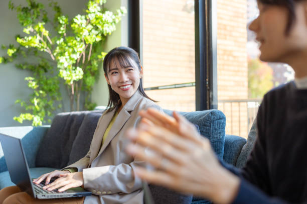 istock Female freelance workers discussing in home office 2200388056