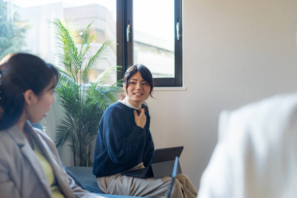 istock Female freelance workers discussing in home office 2200388223