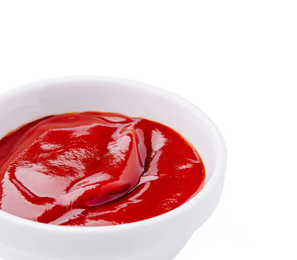 istock Fresh red ketchup in a white bowl ready for serving at a casual meal setting 2200397431
