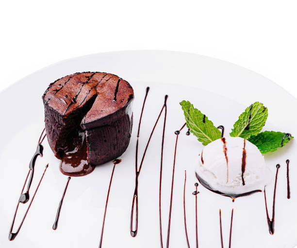 istock Delicious chocolate dessert with mint and ice cream served elegantly on a white plate 2200398015
