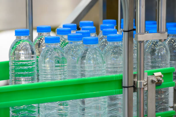istock The  empty drinking water bottles  on the conveyor belt for filling process. 2200398181