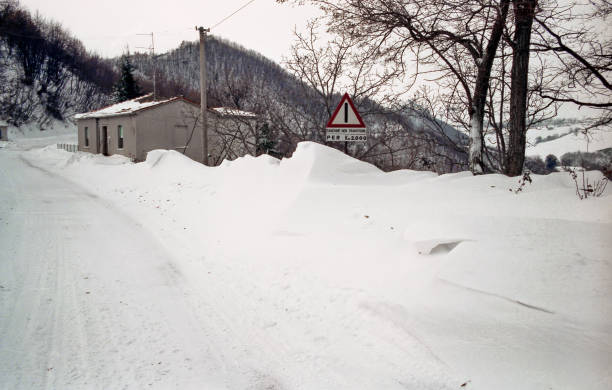 snowdrifts along a road after a blizzard