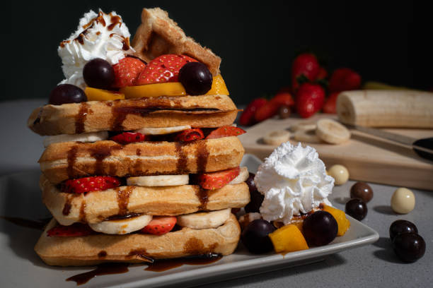 istock waffle tower with fruit, cream and chocolate balls 2200401568
