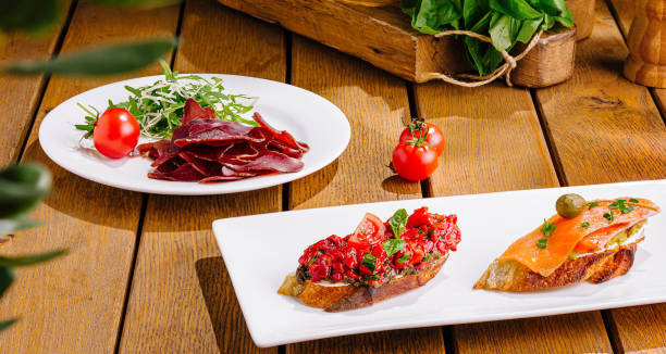 istock Gourmet bruschetta assortment on wooden table 2200402369