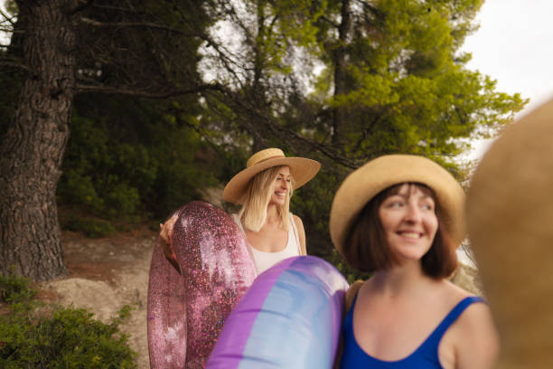 Photo of a couple of young women on their way to the local beach