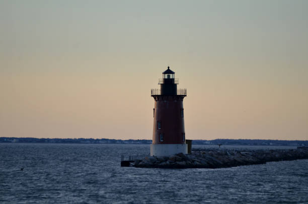 istock Delaware Breakwater Lighthouse Cape Henlopen Delaware Close up Sunset 2200406254