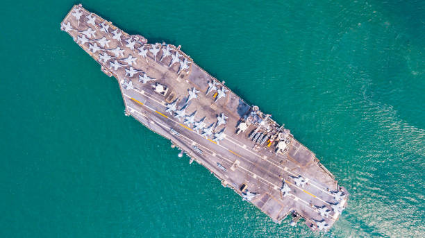 istock An aircraft carrier sails at sea. 2200411070