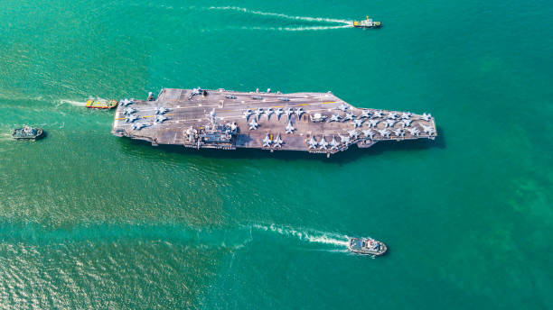 istock An aircraft carrier sails at sea. 2200411084