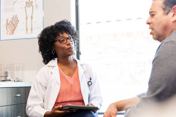istock Doctor and Patient Discussing Health Concerns During Appointment 2200412247