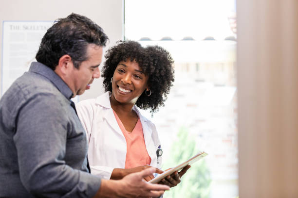 istock Doctor and Patient Discussing Healthcare using Tablet 2200412341