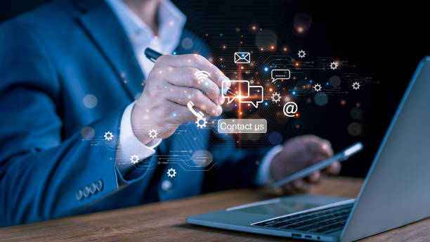 istock A man points to an operator's logo, which features after-sales service imagery. Channel of communication for customer satisfaction 2200412766