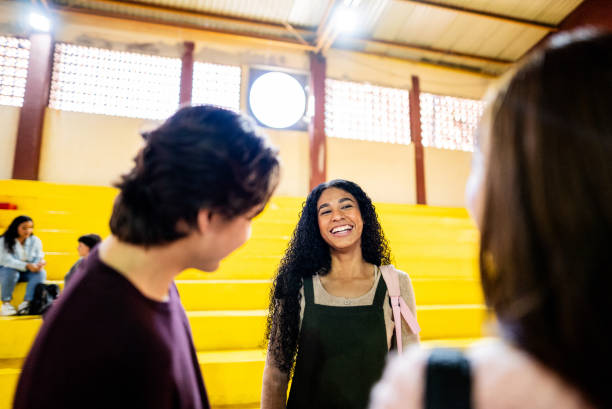 istock Young student friends talking at university gymnasium 2200413155
