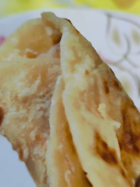 istock Aloo Paratha rolls, Indian Flatbread. wooden background. top view. 2200414346
