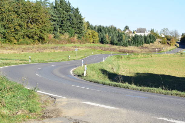 istock road curve into a village 2200422009