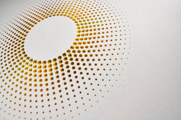 istock Abstract paper cut artwork with circular perforated pattern and golden gradient on a white background 2200423923
