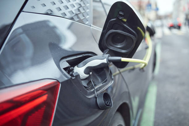 istock Charging electric vehicle on a public charger. 2200426598
