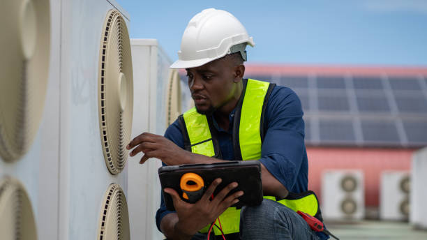 istock Engineers inspecting the air conditioning system in a large building or industrial facility. 2200427303