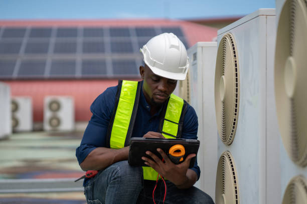 istock Engineers inspecting the air conditioning system in a large building or industrial facility. 2200427327