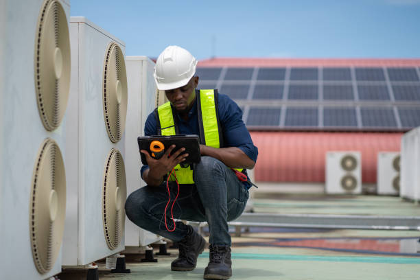 istock Engineers inspecting the air conditioning system in a large building or industrial facility. 2200427549