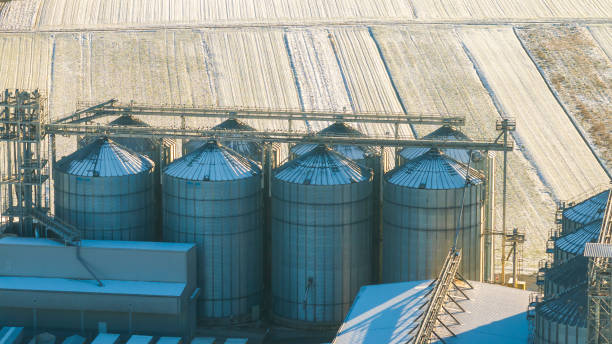 istock Snow-Covered Agricultural Silo in Winter Field 2200427713