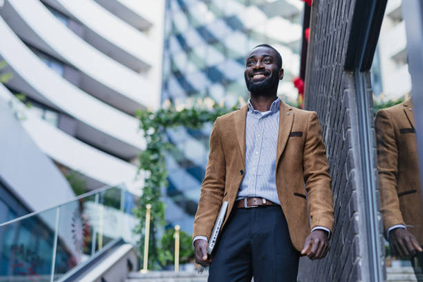 istock Confident Businessman Walking in Urban Environment 2200428510