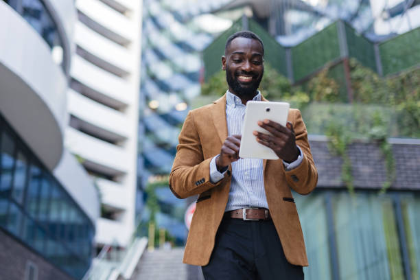 istock Businessman Using Digital Tablet Outdoors 2200428519