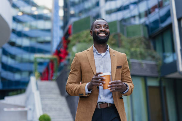 istock Confident Businessman Enjoying Coffee Break Outdoors 2200428541