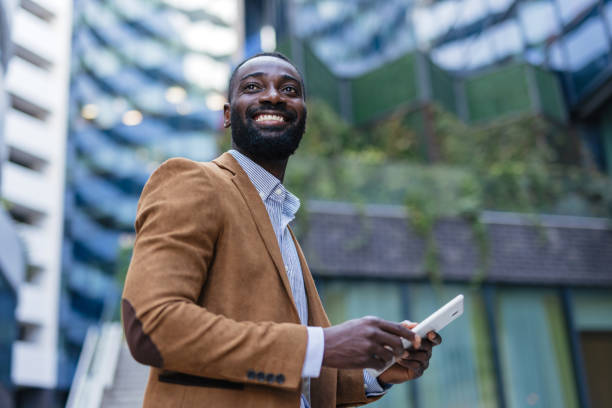 istock Confident Professional Holding a Tablet Outdoors 2200428547