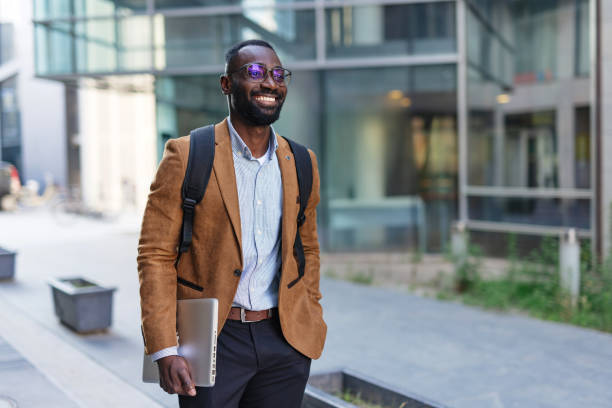 istock Confident Young Adult Walking in Urban Setting 2200428597