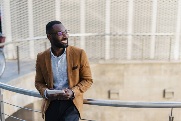 istock Young Professional Man Holding Tablet Outdoors 2200428673