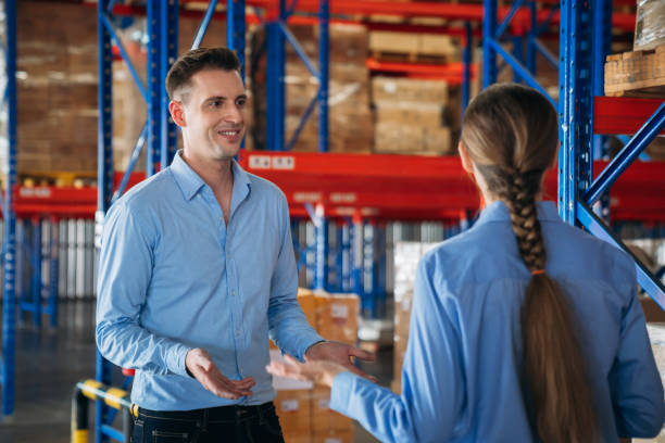 istock Warehouse worker working and checking the stock in the warehouse. .Factory manager using digital tablet check barcode in industry factory logistic. 2200429839