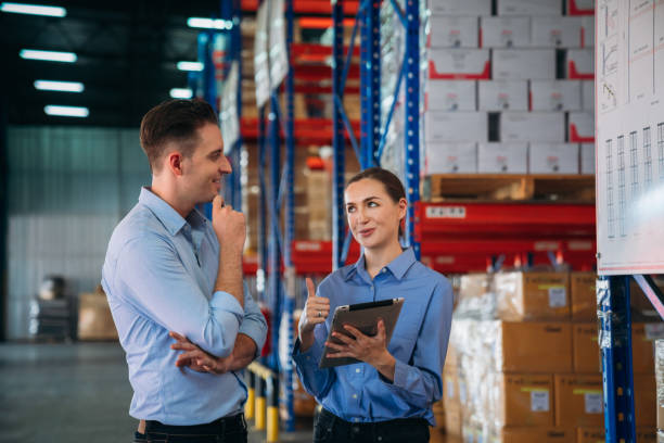 istock Warehouse worker working and checking the stock in the warehouse. .Factory manager using digital tablet check barcode in industry factory logistic. 2200429895