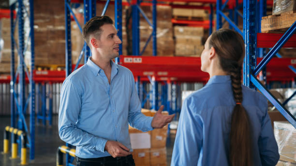 istock Warehouse worker working and checking the stock in the warehouse. .Factory manager using digital tablet check barcode in industry factory logistic. 2200430012